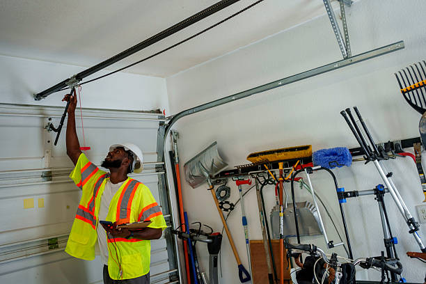 Professional Garage Door Panel Replacement technician working in Duquesne, MO